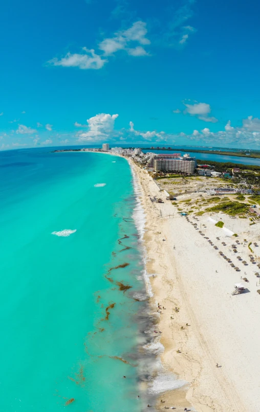 the ocean is clear and bright blue next to an island