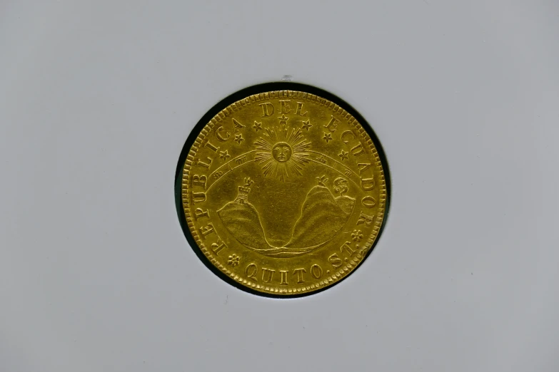 there is a gold coin with an image on it