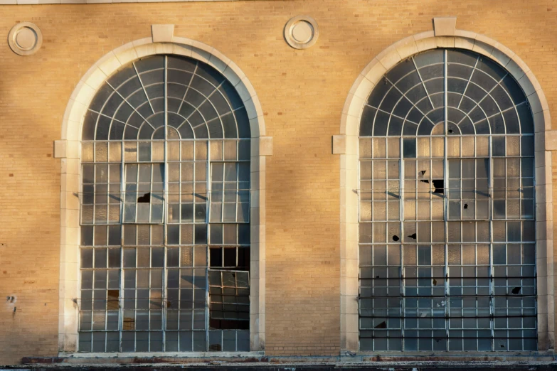 two window of a building with arched glass doors