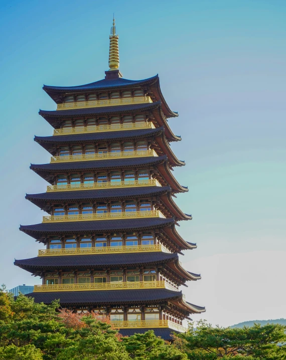 the pagoda is tall, and has many windows