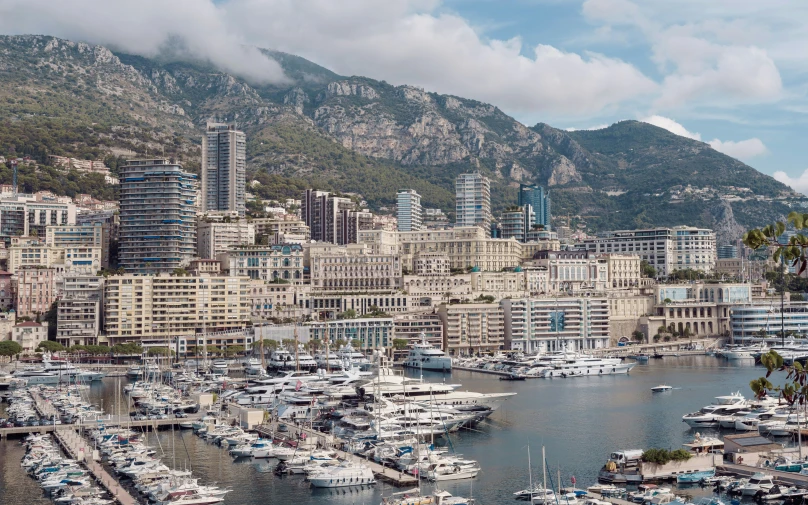 a city and harbor with a mountain in the background