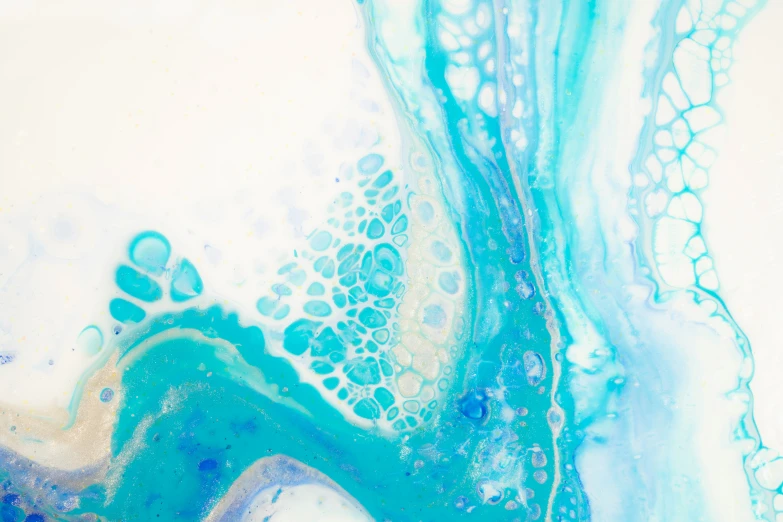 an artistic painting of blue and yellow liquid