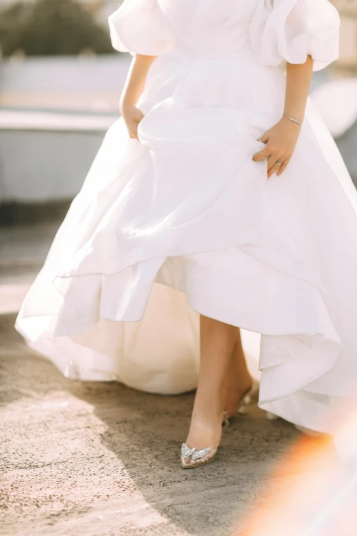 a bride poses in a strapless white gown