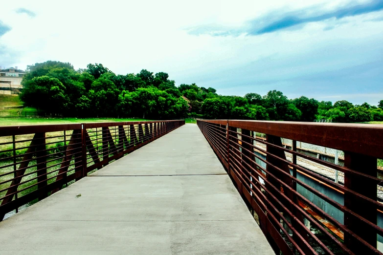 a very long bridge that has a little path going across it