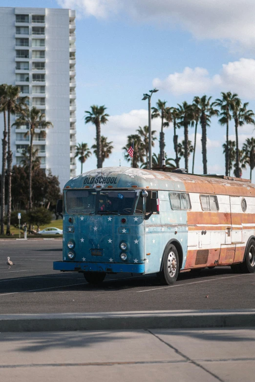 an old rusty bus parked on the side of the road