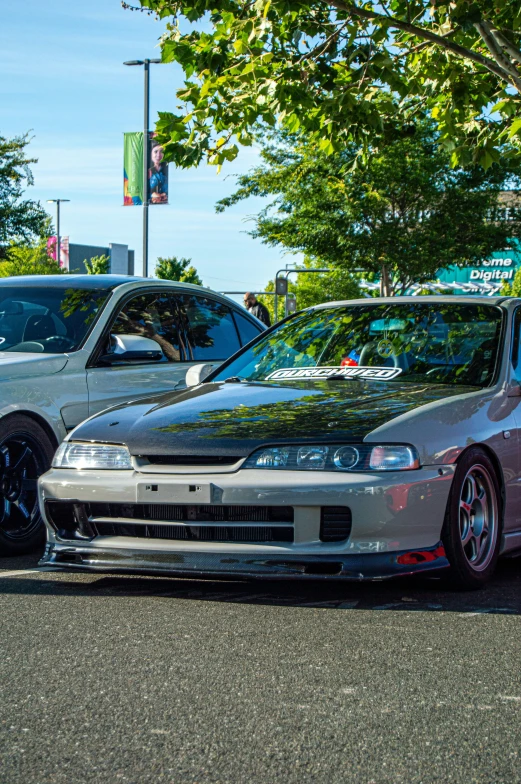 some cars are parked along side each other on the street