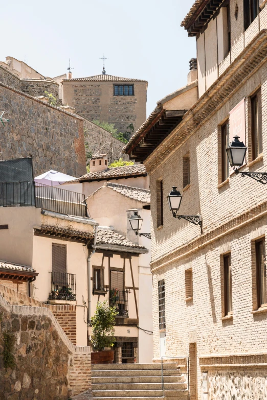 a street in a village with two building that have balconies on the side