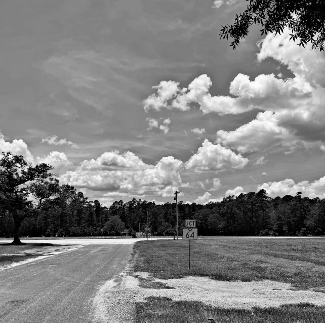 a deserted road is shown on a beautiful day