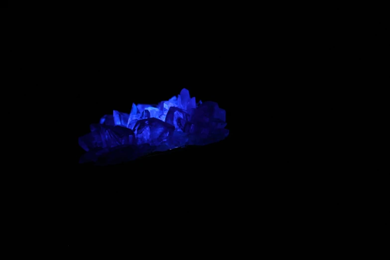 a large piece of blue rock with lights