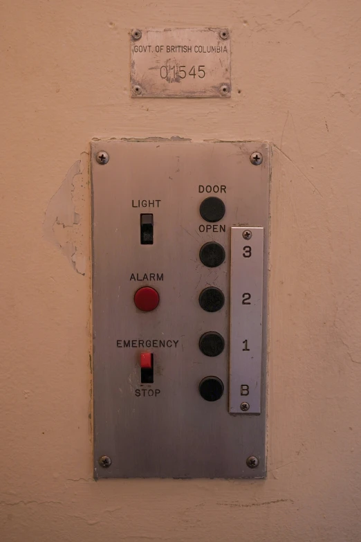 the control panel is on the wall for all sorts of people to use