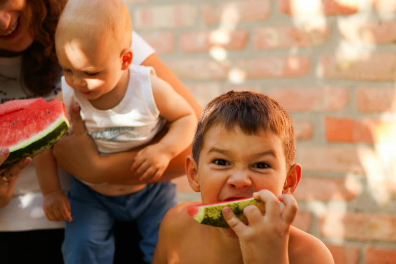 the  is eating a piece of watermelon