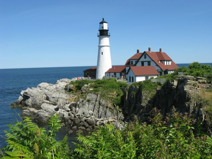 the lighthouse is built on top of a rock