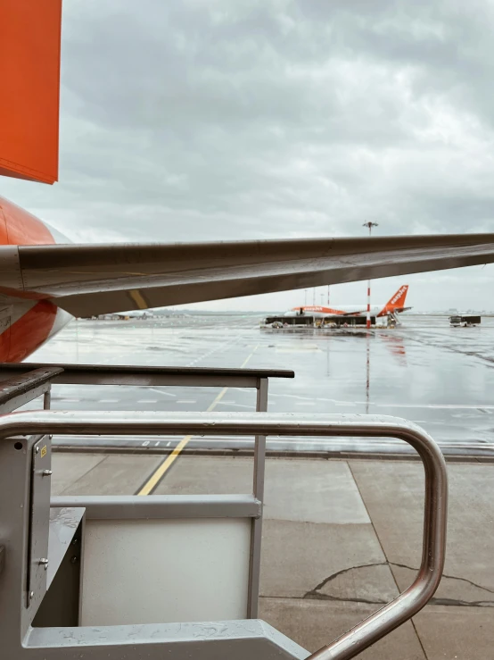 the tail end of an airplane that is on the runway