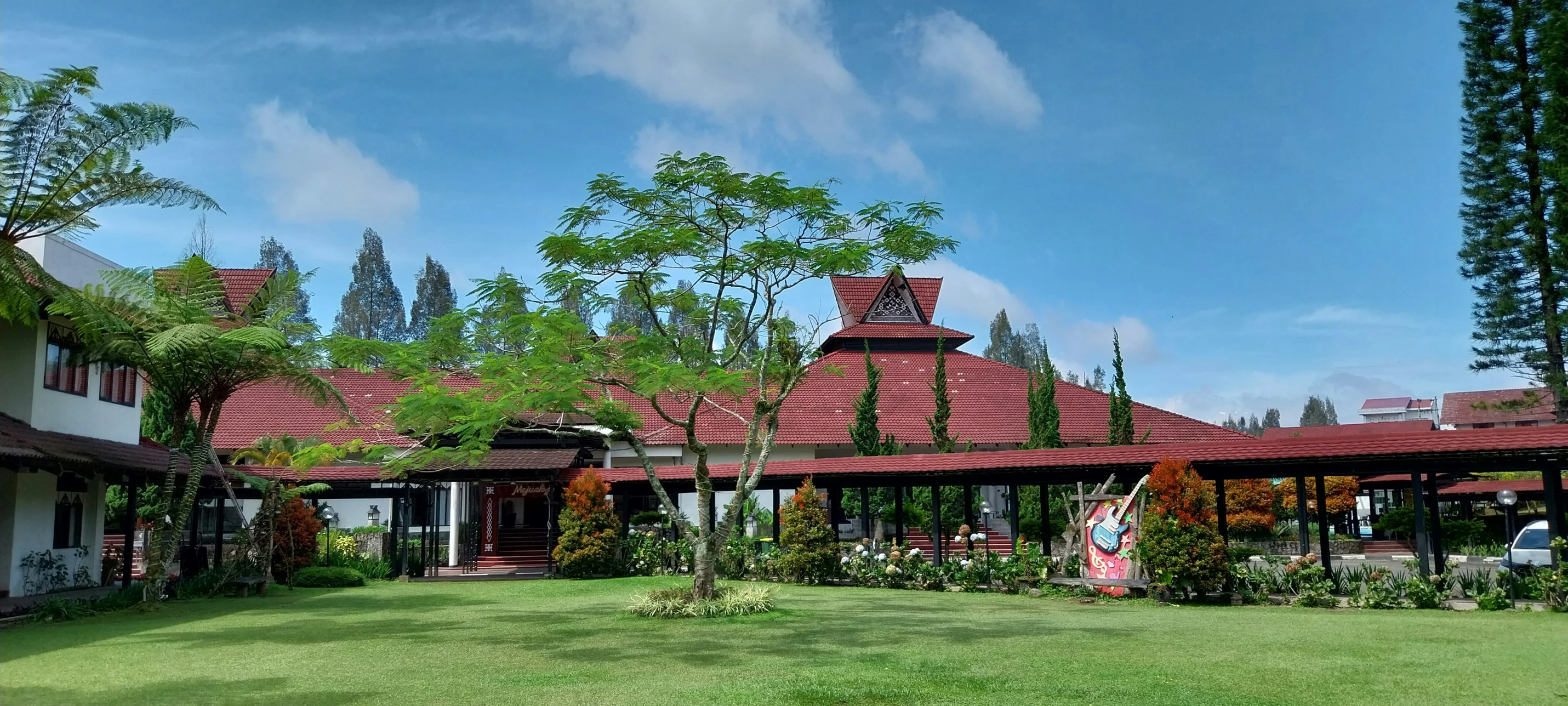 an outside area of a building with several gardens and trees