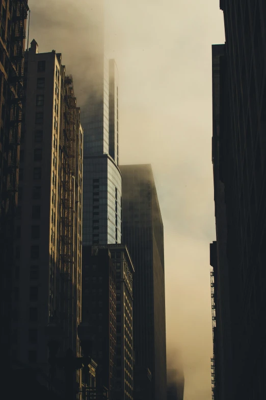 a large city with some buildings with a lot of clouds