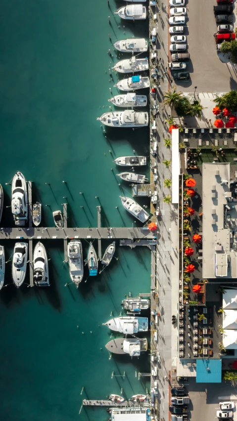 a dock filled with lots of boats near water