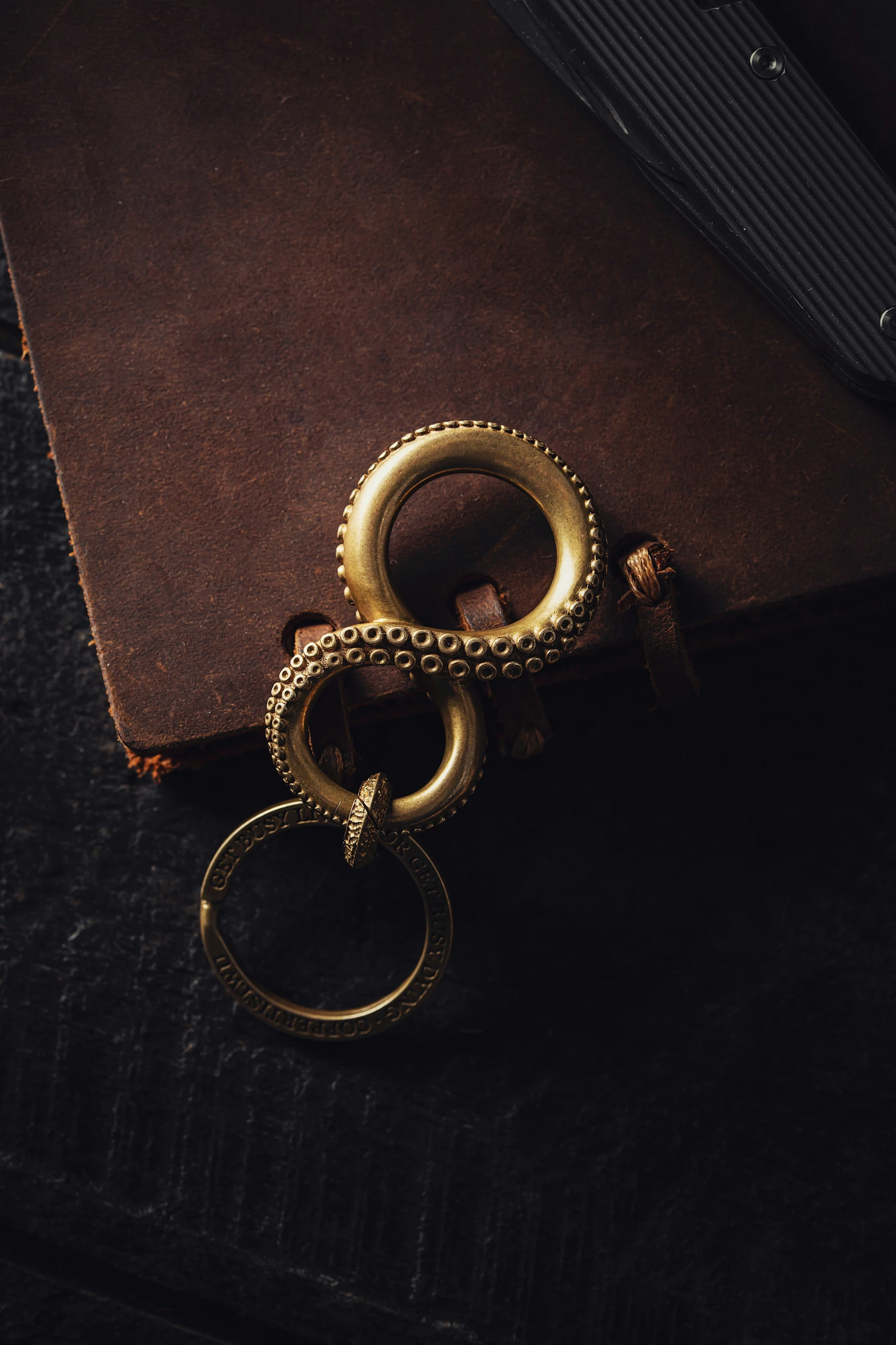 two wedding rings on top of a bible