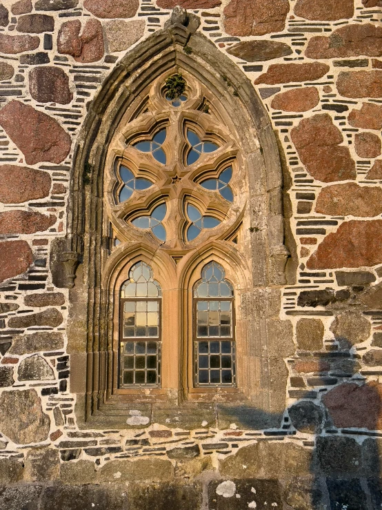 old church building with stone windows and stone wall