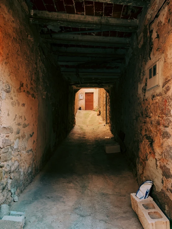 two suitcases sit in the light in the hallway