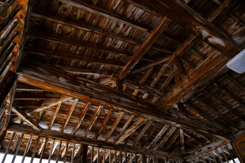 the roof of a covered building with a tall clock