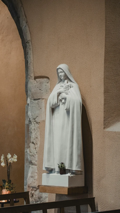 a statue in a church setting that appears to be of jesus