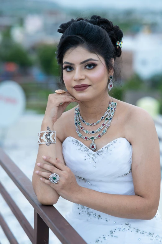 the woman is posing for a po on the balcony