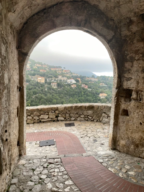 a stone wall with a tunnel cut in to it