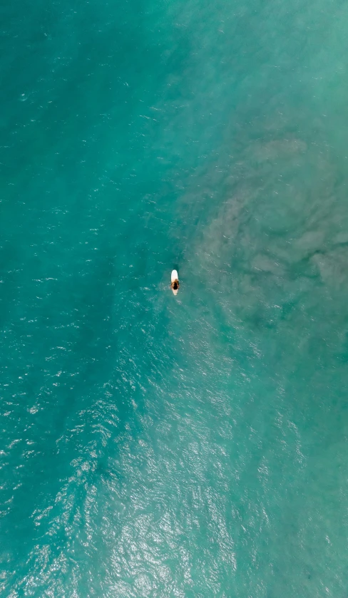 an aerial s of a single boat in the water