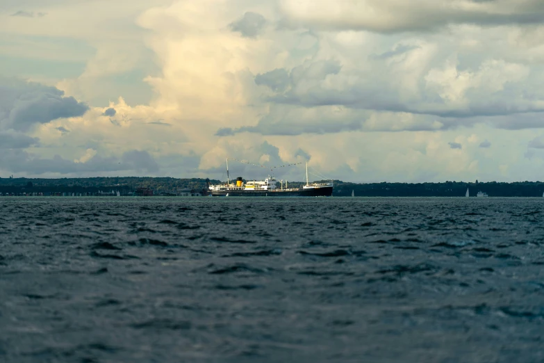 a large ship floating across a large body of water