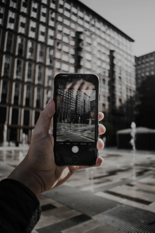 a person taking a pograph with their cellphone