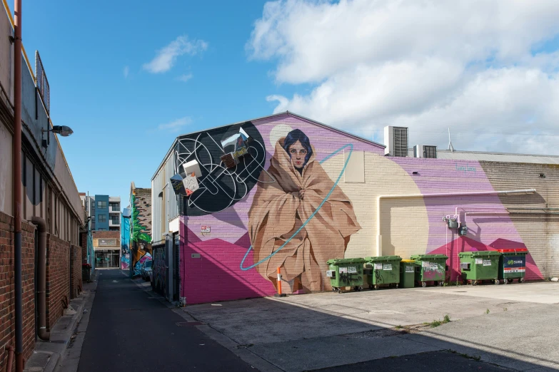 mural on a wall depicting a girl holding a baseball bat