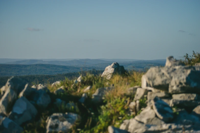 there is a large rock on a mountain