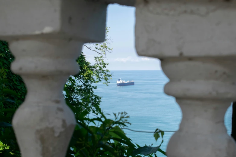 a ship on the water near some trees