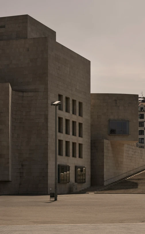 an outdoor walkway with stairs leading to an unfinished building