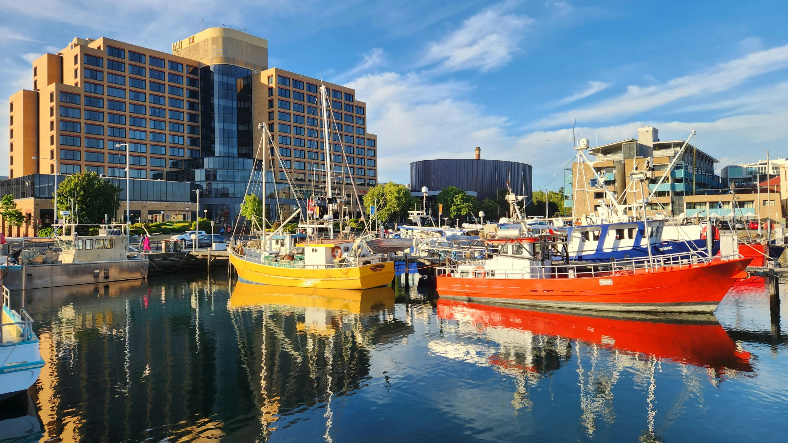 a marina filled with lots of boats on top of water