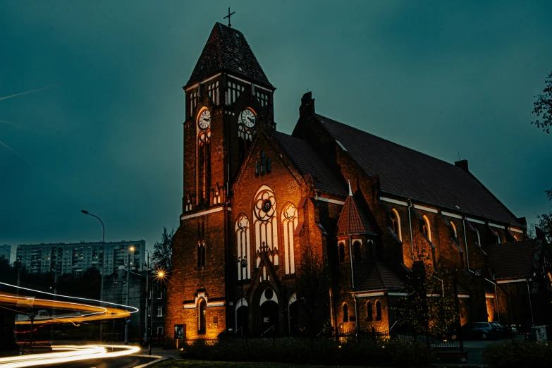 the tall cathedral building has several windows and a clock