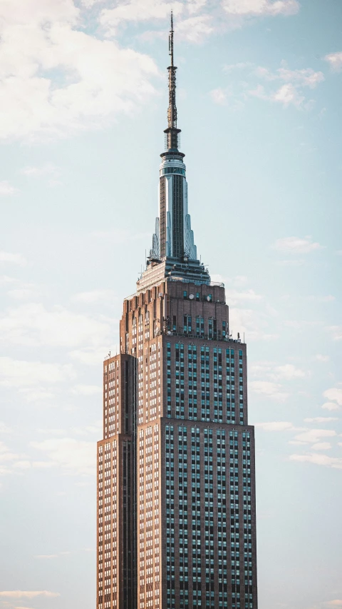 a tall building with an spire in the middle