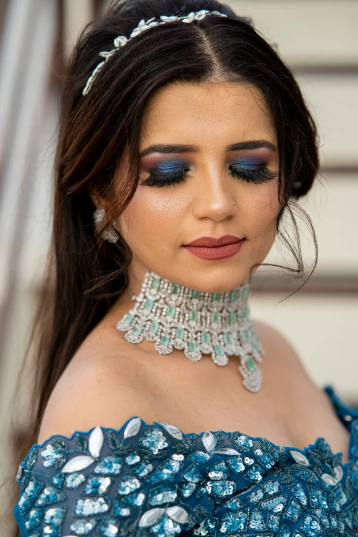 a beautiful woman with a tiara and matching necklace