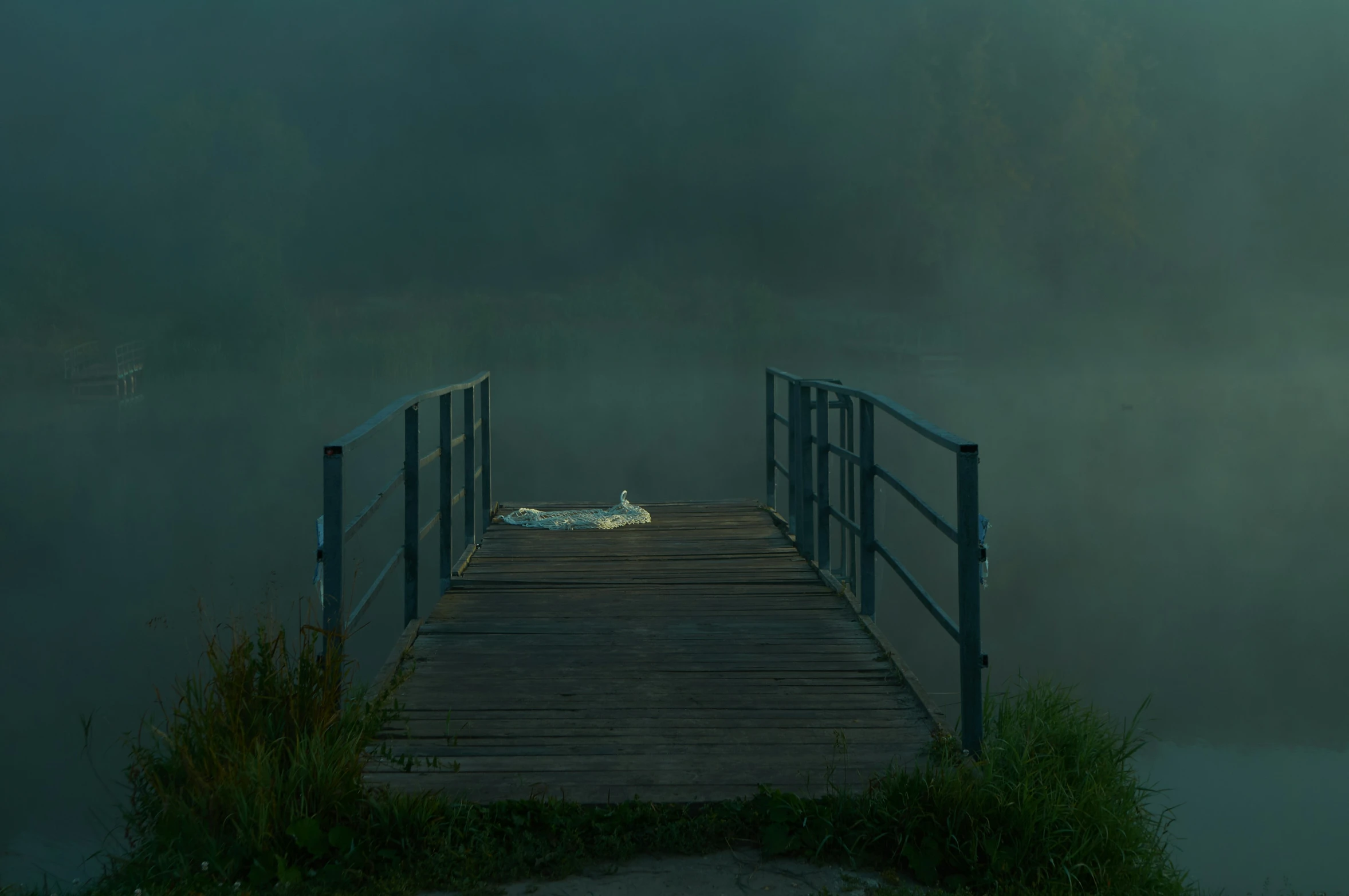 a po of a dock that is covered in fog