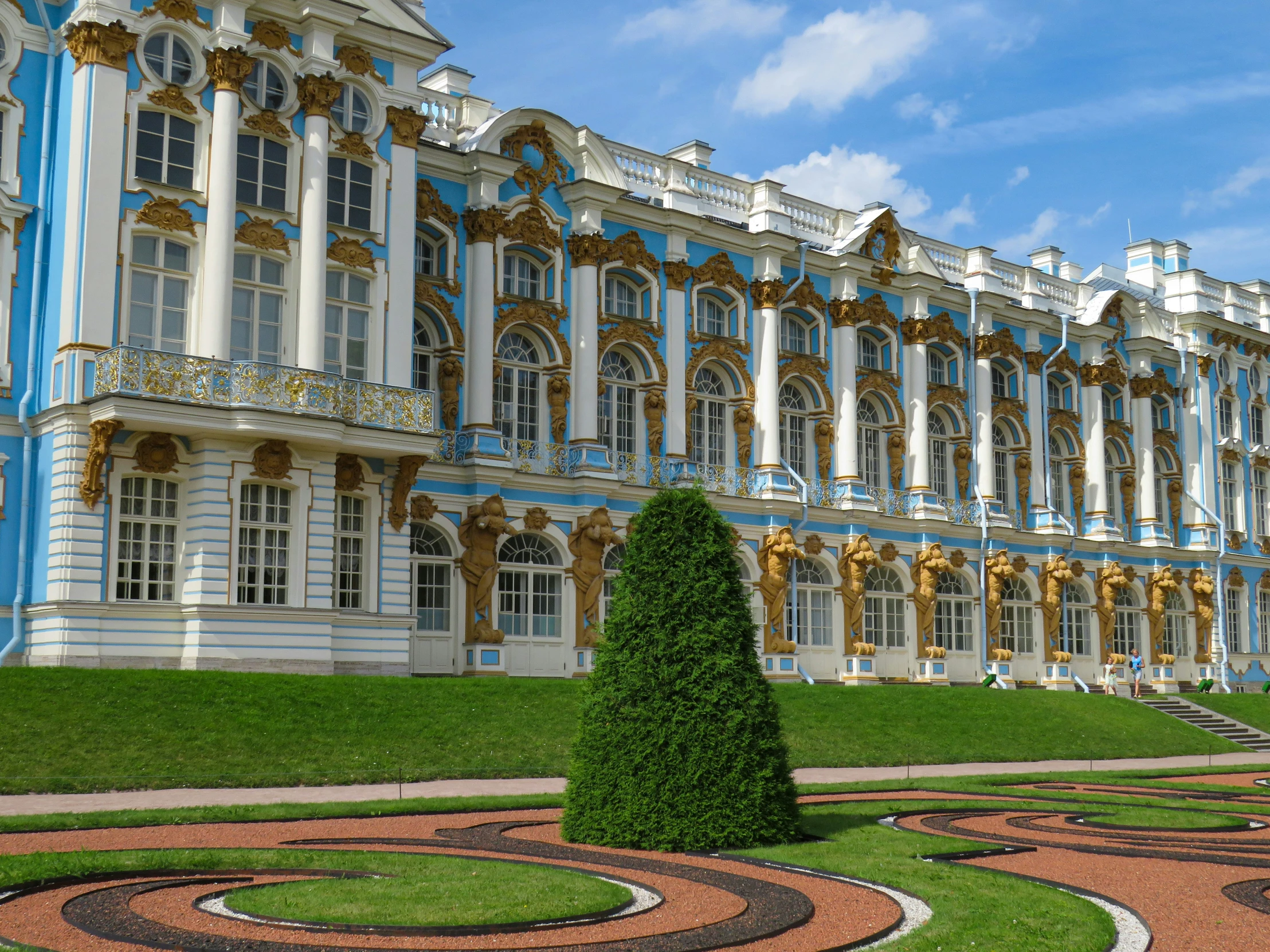 some very pretty buildings by some grass