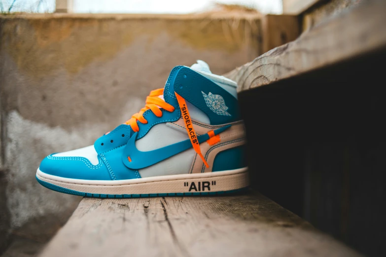 an image of blue and orange air jordan shoes