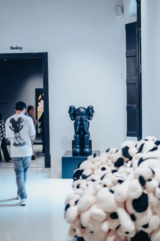 there are people looking at art in a museum