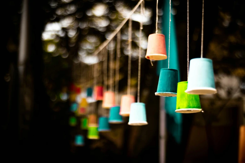 different colored hanging lights hanging from wires