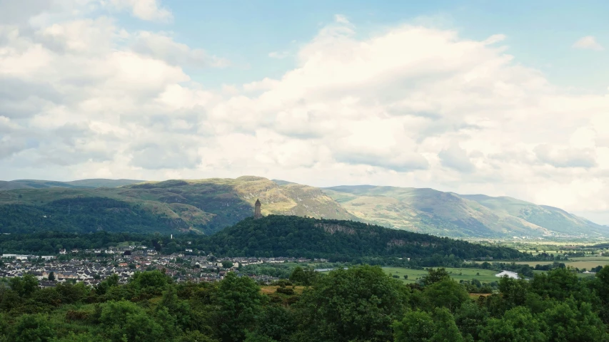 the mountain range is full of lush green trees