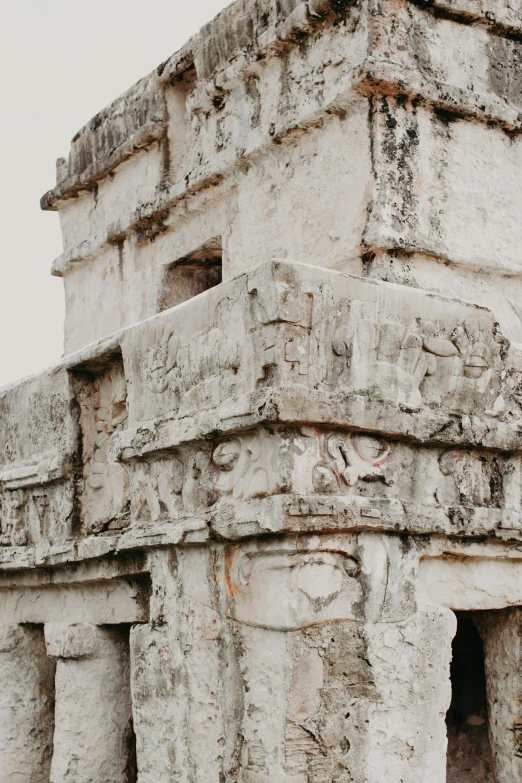 an old building made out of stone with figures carved into it