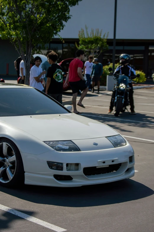 a white car parked at a parking lot