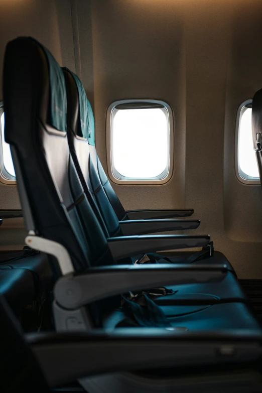 the seats are empty as seen through an airplane window