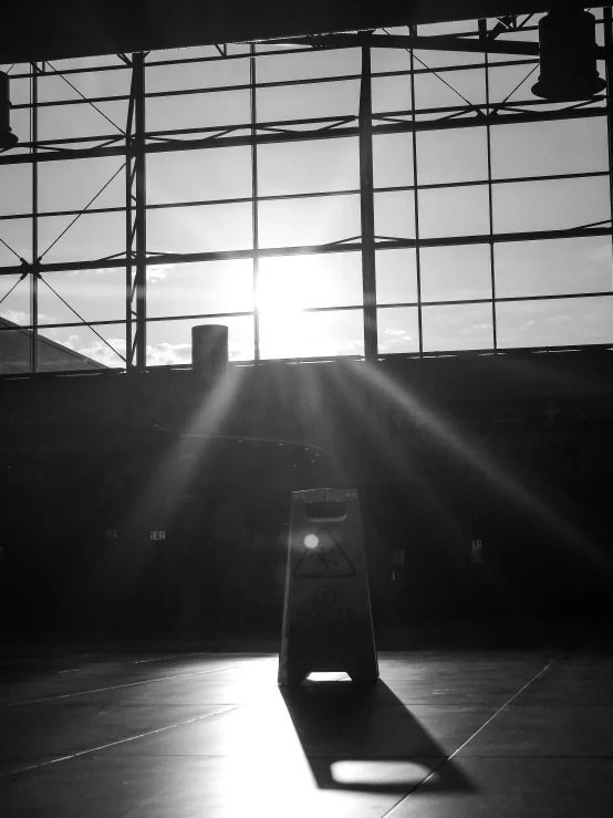 an empty container in the sun surrounded by wires