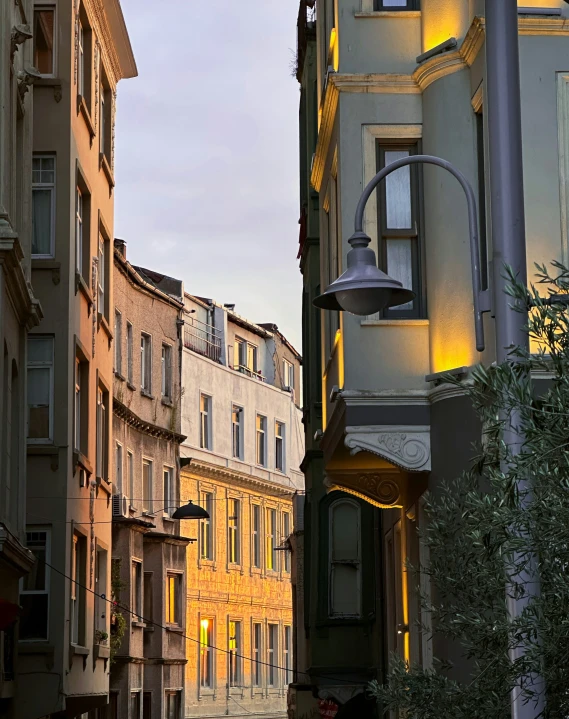 a person standing on a city street between two buildings