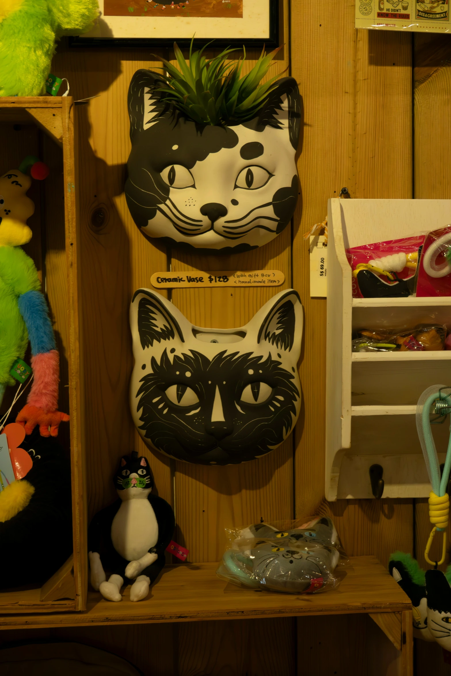 several black and white masks hanging on wooden walls